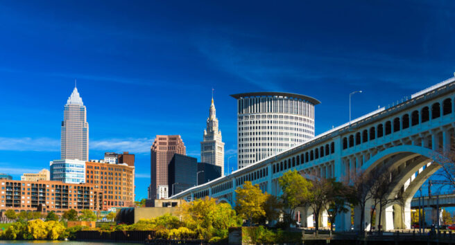 Downtown Cleveland with River, Bridge, Trees, and Deep Blue Sky