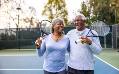 Senior Black Couple Walking Off the Tennis Court