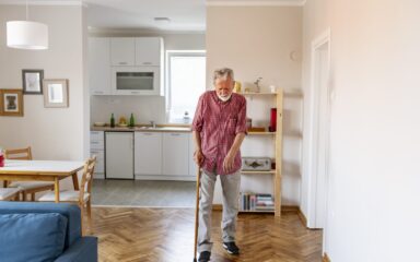 Senior Man Walking With Cane