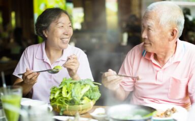 happy Senior Couple Enjoying hot pots In Restaurant