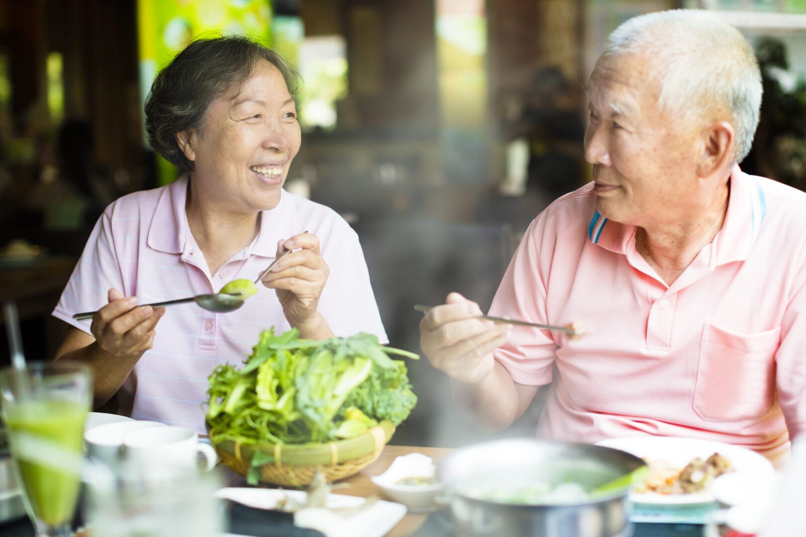 Search by image or video Happy Senior Couple Enjoying hot pots In Restaurant