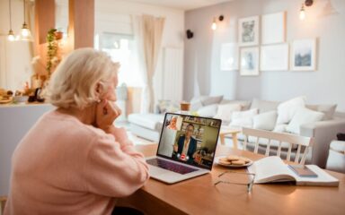Senior woman talking to her counsellor over a video call