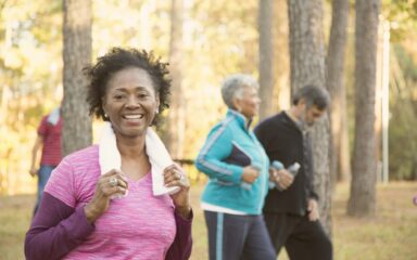 Senior adult friends exercising outdoors.