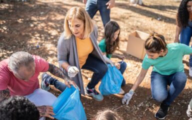 People picking up garbage to clean a public park