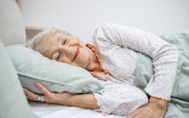 Senior woman sleeping in bed