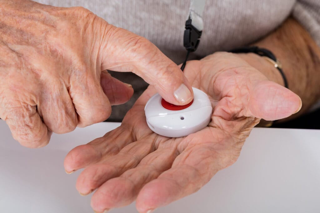 Senior Woman Pressing Medical Alert Button