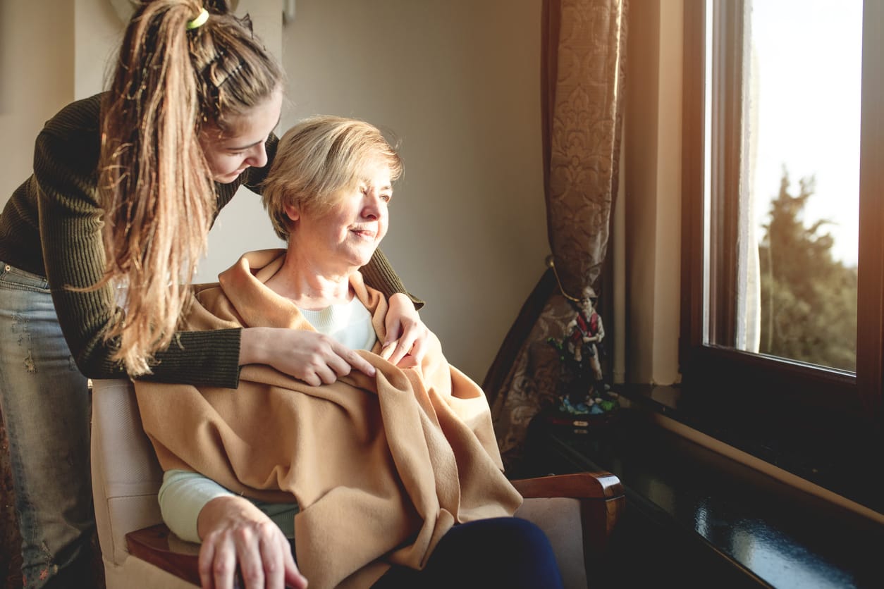 ALL About Alzheimer's: Understanding Alzheimer's & Dementia – A Guide to Senior Care Options. A young caregiver comforts an elderly woman, symbolising support and compassion in navigating Alzheimer's and dementia care decisions.